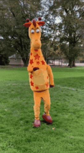 Giraffe Mascot Standing In Field GIF