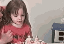 Girl Blowing Birthday Candle With Playful Kid GIF