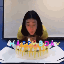 Girl Carefully Blowing Birthday Candles