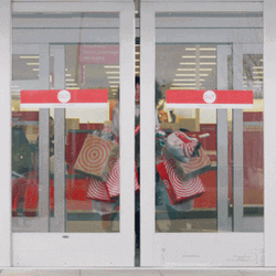 Girl Carrying Target Boxes GIF