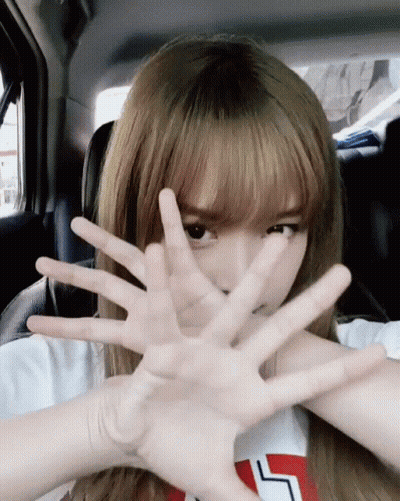 Girl Covering Face In Car With L Shirt GIF