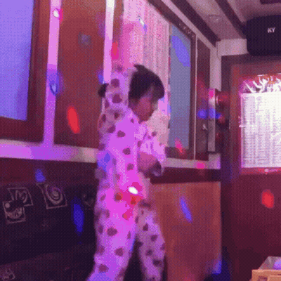 Girl Dancing In Pajamas With Ky Sign GIF