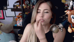 Girl Doing Chef's Kiss While Sitting GIF