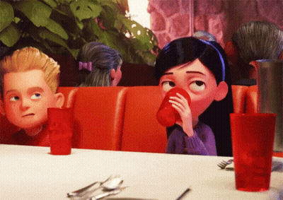 Girl Drinking From Red Cup At Table GIF