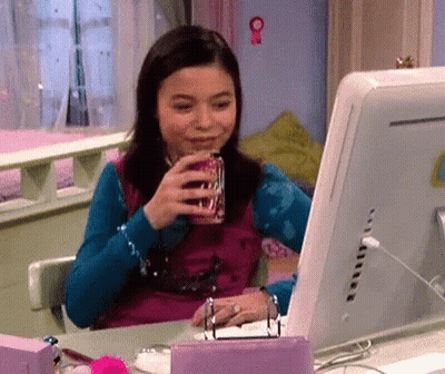 Girl Drinking Soda At Computer Desk GIF