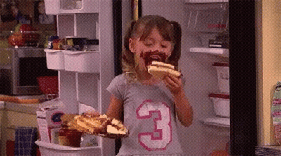 Girl Eating Hot Dog In Fridge With Chocolate Face GIF