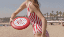Girl Enjoying Frisbee At Beach GIF