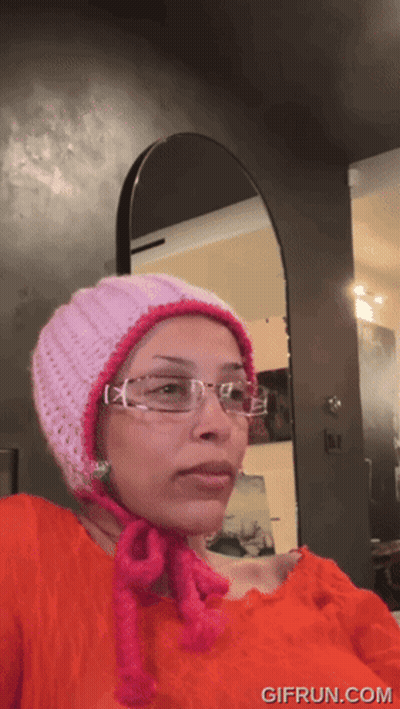 Girl Giving Thumbs Up In Front Of Blackboard Saying EV GIF