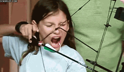 Girl Had A Missing Tooth On Archery GIF