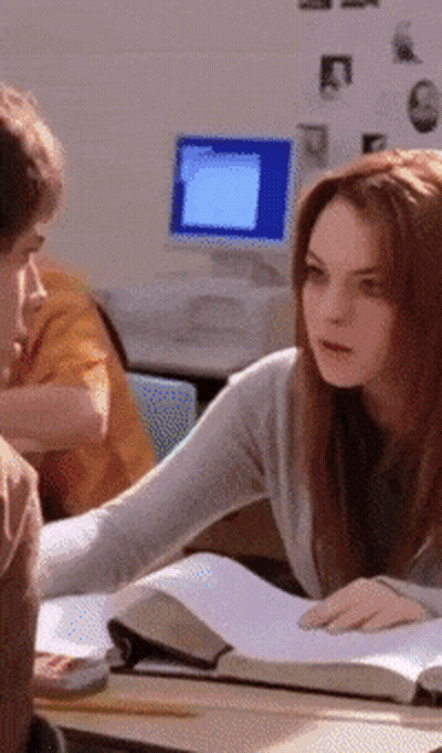 Girl Helping Boy With Homework GIF