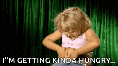 Girl Holding Belly Saying I'm Getting Hungry GIF