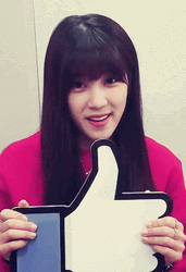 Girl Holding Big Like Button GIF