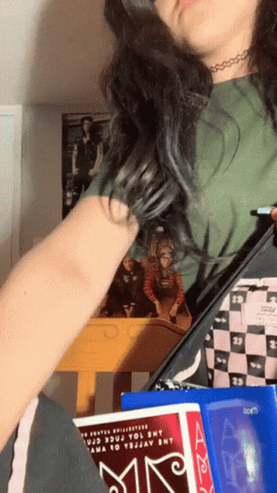 Girl Holding Book Saying A GIF