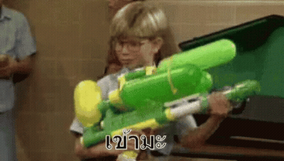 Girl Holding Green And Yellow Water Gun GIF