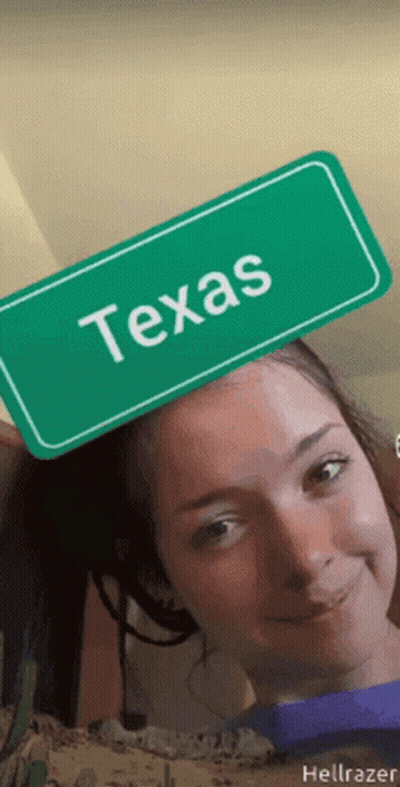 Girl Holding Green Sign Saying Texas On Head GIF