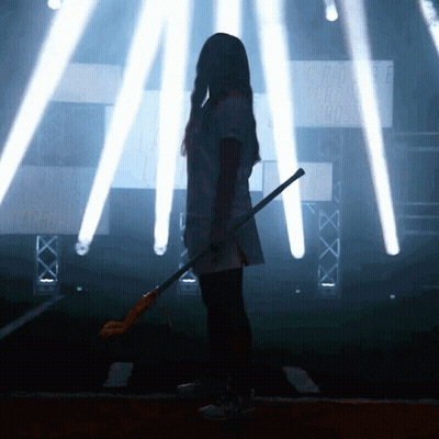 Girl Holding Lacrosse Stick In Front Of Cross Sign GIF