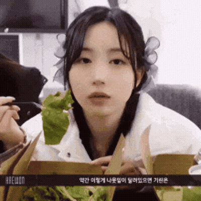 Girl Holding Lettuce GIF