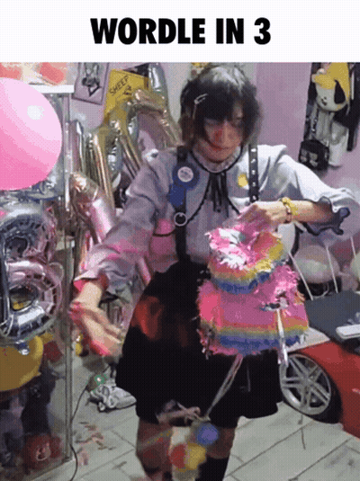 Girl Holding Pinata In Front Of Balloons Wordle In 3 GIF