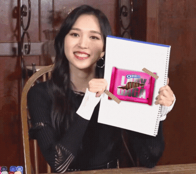 Girl Holding Pink Oreo Bar GIF