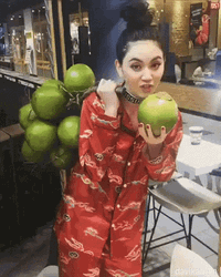 Girl Holding Plenty Of Coconut Tree GIF