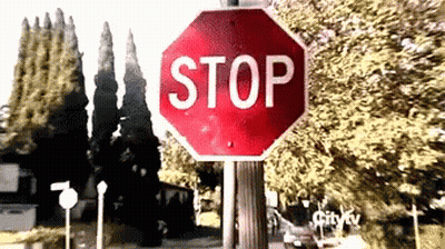 Girl Holding Stop Sign GIF