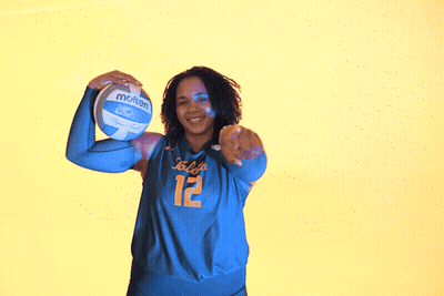 Girl Holding Volleyball In Front Of Toledo Wall GIF