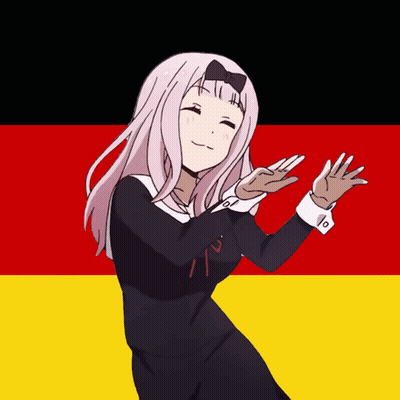 Girl In Black Dress Dancing In Front Of Red And Yellow Flag GIF