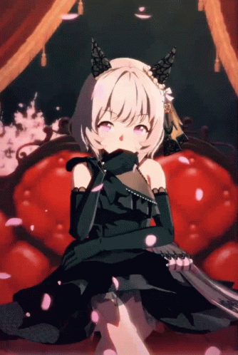 Girl In Black Dress Sitting On Red Chair GIF