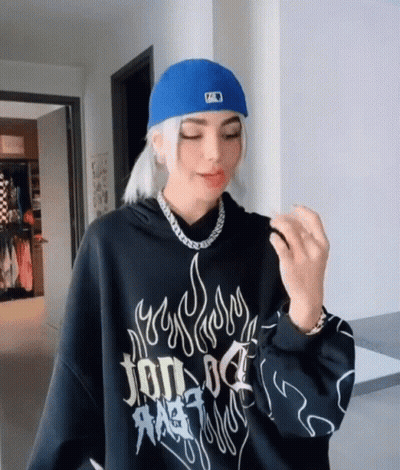 Girl In Black Hoodie And Blue Hat With Letter A GIF