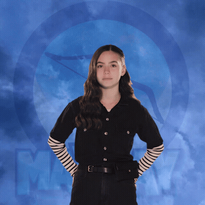 Girl In Black Shirt With Striped Sleeves And Letter M GIF