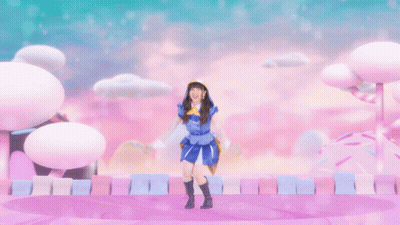 Girl In Blue And Yellow Outfit Jumping With Arms Up GIF
