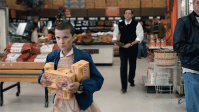 Girl In Blue Jacket Carrying Boxes Of Eggs GIF