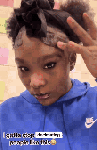 Girl In Blue Nike Hoodie Making A Face GIF