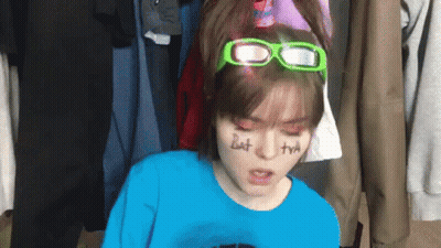 Girl In Blue Shirt And Green Glasses Saying But GIF