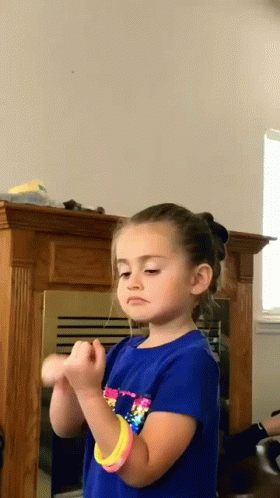 Girl In Blue Shirt And Pink Bracelet GIF