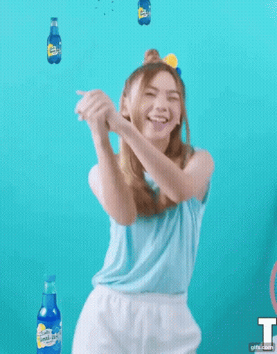 Girl In Blue Shirt And White Shorts Dancing With Sprite Bottles GIF