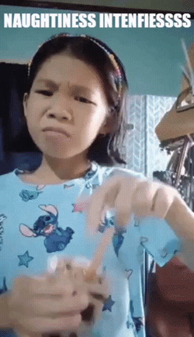 Girl In Blue Shirt Holding Cup Making Face GIF