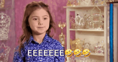 Girl In Blue Shirt Making Funny Face GIF