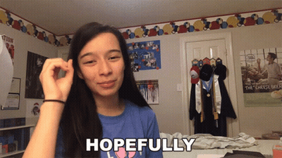 Girl In Blue Shirt Saying Hopefully GIF