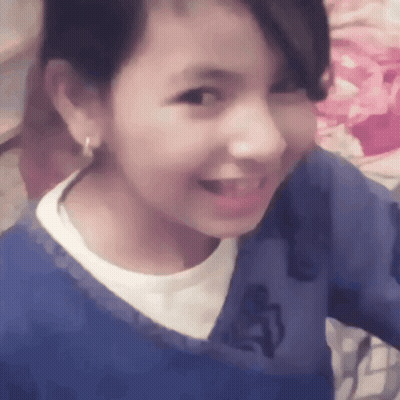 Girl In Blue Shirt With Letter A Smiling GIF