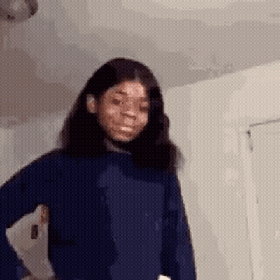 Girl In Blue Sweater Making Funny Face GIF
