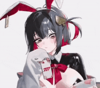 Girl In Bunny Costume Holding Playing Card GIF