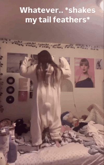 Girl In Cat Costume Shaking Tail Feathers GIF