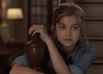 Girl In Denim Shirt Leaning On Wooden Pillar GIF