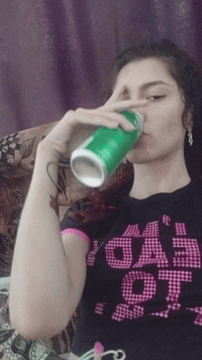 Girl In 'Eeep' Shirt Drinking From Green Can GIF