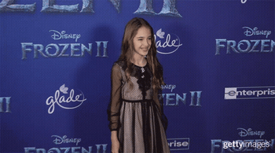 Girl In Front Of Frozen II Advertisement GIF