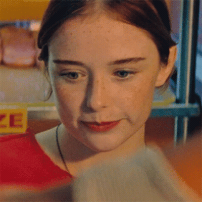 Girl In Front Of Yellow Prize Sign GIF