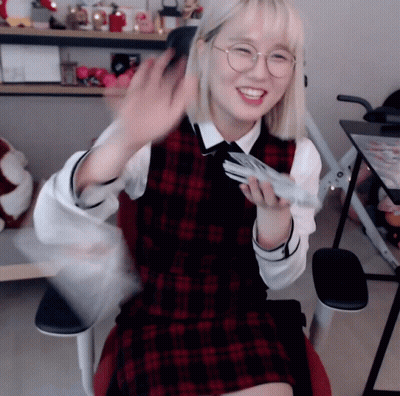 Girl In Glasses And Plaid Vest Sitting GIF
