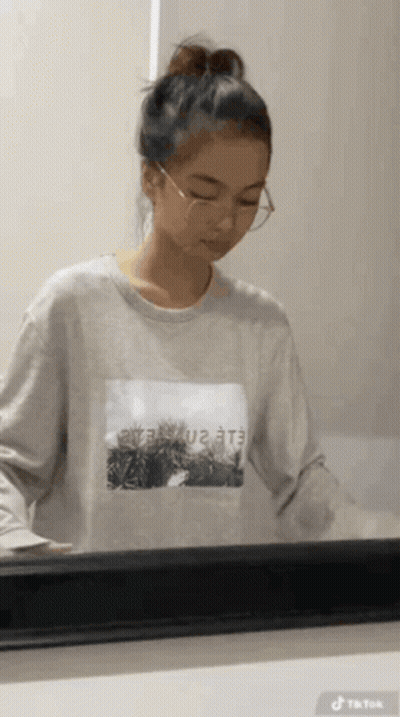 Girl In Glasses And Sweatshirt Saying Eee GIF