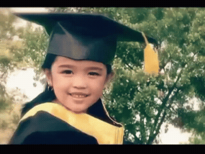 Girl In Graduation Cap And Gown GIF